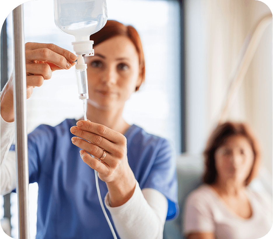 Healthcare worker using infusion therapy on patient